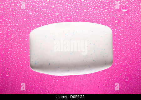 Soap bar on pink abstract background Stock Photo