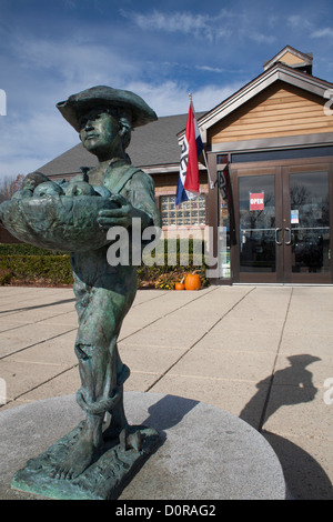 A statue of Johnny Appleseed welcomes visitors to the Massachusetts Visitor Center in Lancaster, Massachusetts. Stock Photo