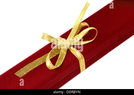 Red jewelry box with gold ribbon Stock Photo