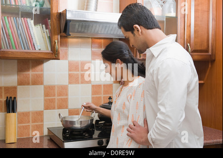 Couple cooking in the kitchen Stock Photo