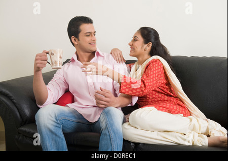 Couple having fun with a cup of coffee Stock Photo