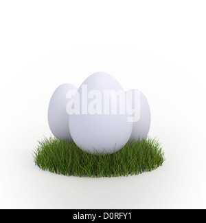 Three eggs in a patch of grass Stock Photo