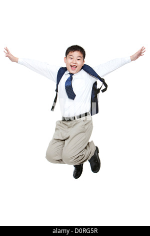 Carefree schoolboy jumping in mid-air with excitement Stock Photo