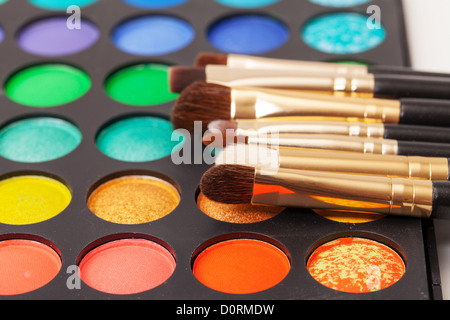 Set of Multicolored Eyeshadows with Brushes Stock Photo