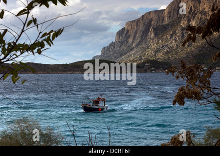 Small fishing boat in stormy sea, Kalymnos, Greece Stock Photo