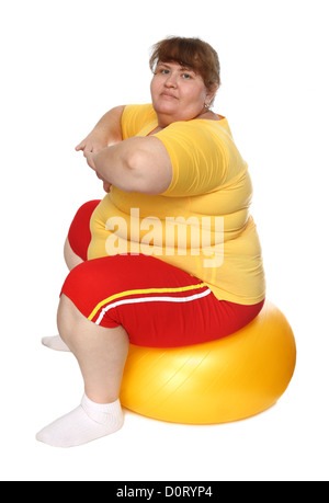 exercising overweight woman on ball Stock Photo