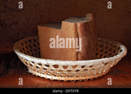 old bread in wooden basket Stock Photo
