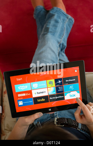 Woman using Microsoft Surface rt tablet computer Stock Photo