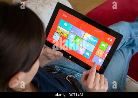 Woman using Microsoft Surface rt tablet computer Stock Photo