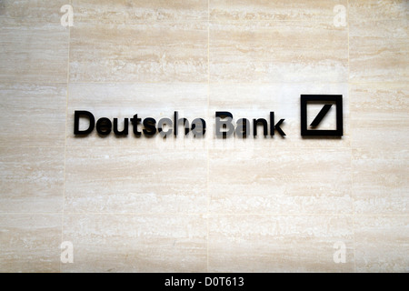 The Deutsche Bank logo on a wall outside offices in Bishopsgate, London, UK. Stock Photo