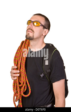 Rock-climber in sun glasses looks upwards Stock Photo