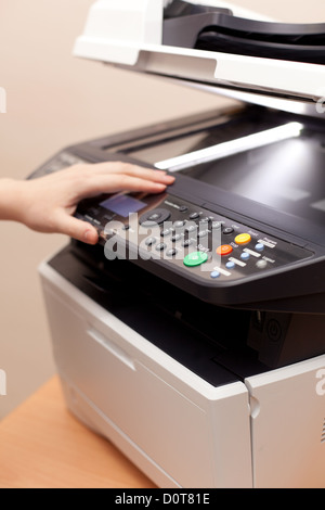 Woman's hand with open copier Stock Photo
