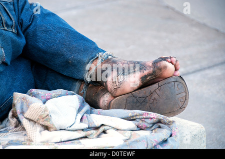 homeless man sleeping on bench Stock Photo