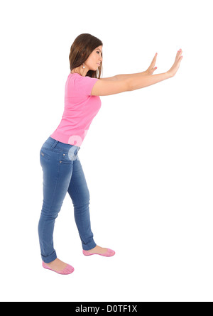 Isolated young casual woman push wall Stock Photo