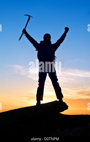 Mountaineer on top mountain Stock Photo