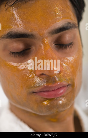 Close-up of a man with peel off mask Stock Photo