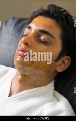 Close-up of a man with peel off mask Stock Photo