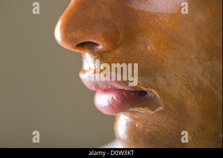 Close-up of a man with peel off mask Stock Photo