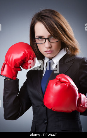 Young businesswoman in boxing concept Stock Photo