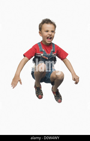 Boy jumping and shouting Stock Photo