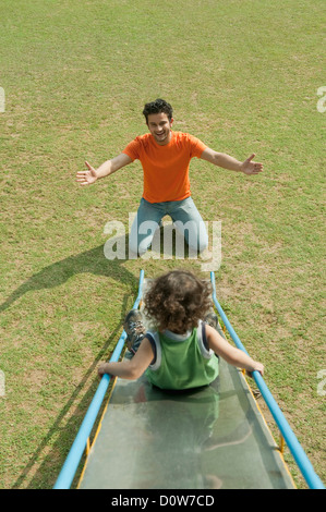 Man playing with his son in a garden Stock Photo