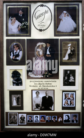 Photographs of Polish bride and groom during pre wedding photography session displayed in a shop front of a wedding photographer shop in Krakow Poland Stock Photo