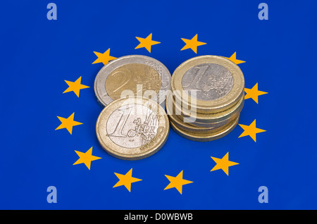 euro coins on european flag Stock Photo