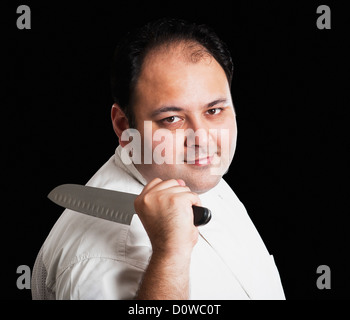 Portrait of a chef holding a knife Stock Photo