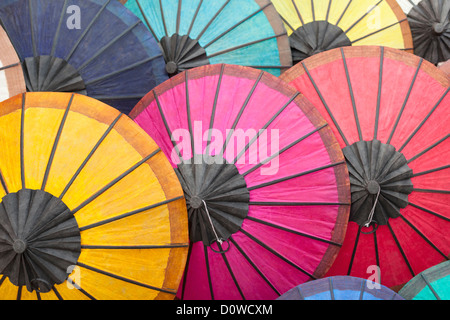 Multicoloured paper umbrellas or parasols on display at  Luang Prabang evening market, Laos Stock Photo