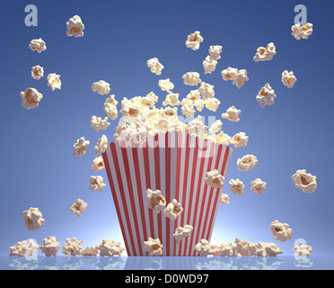 Popcorn exploding inside the packaging striped. Stock Photo