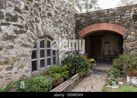 Window and arched walkway of the convento at Mission Espada in San Antonio, Texas Stock Photo