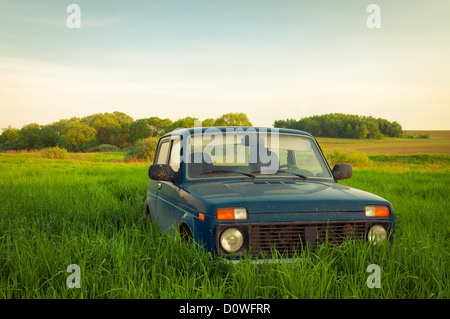 Russian SUV Lada Niva (VAZ 2121) . The car goes along the mountain road ...