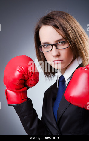 Young businesswoman in boxing concept Stock Photo