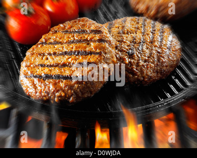 Beef burgers being cooked. Food photos, pictures & images. Stock Photo