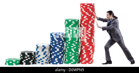Businessman and casino chips on white Stock Photo