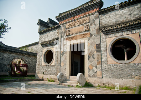 An old traditional Chinese brick house with carved beams and eaves Stock Photo