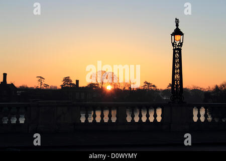 2nd December 2012. Hampton Court, SW London, UK. Sunrise over the River Thames from Hampton Court Bridge. Stock Photo