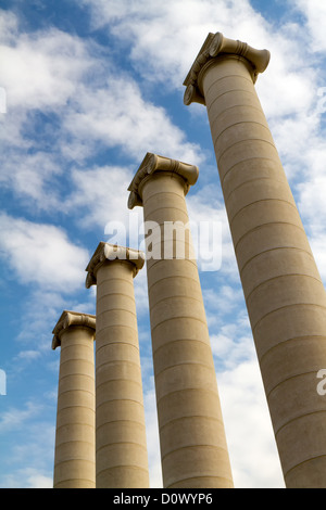 Four massive columns, blue sky Stock Photo