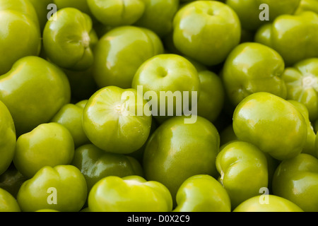 Closeup: Bright Green tomatillos. A basket of of bright green tomatillos shot from above. Stock Photo