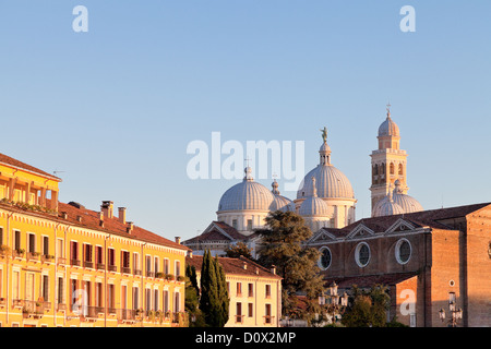 houses on Prato della Valle with a view of the Basilica of Santa Giustina of Padua, Italy at evening Stock Photo