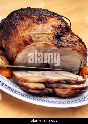 Roast leg of pork rolled boned glazed Stock Photo