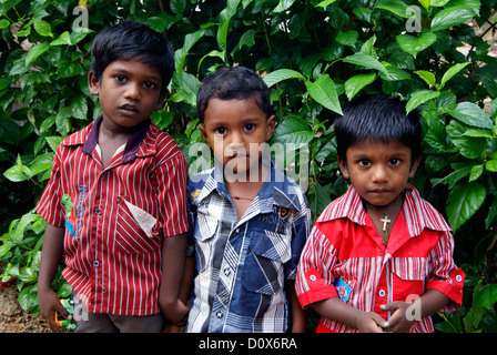 Cute Indian Village Children face expression while anxiously posing in front of camera at Kerala India Stock Photo