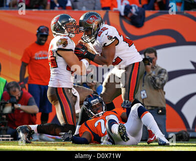 Dec. 2, 2012 - Florida, U.S. - Denver) Tampa Bay Buccaneers tight end Dallas Clark (44), left, gets up to celebrate a touchdown with running back Doug Martin (22) during the first quarter, as Denver Broncos strong safety Mike Adams (20) lies on the ground. FIRST HALF ACTION: The Tampa Bay Buccaneers play the Denver Broncos at Sports Authority Field at Mile High on Sunday. At halftime, the Tampa Bay Buccaneers lead, 10-7. (Credit Image: © Daniel Wallace/Tampa Bay Times/ZUMAPRESS.com) Stock Photo