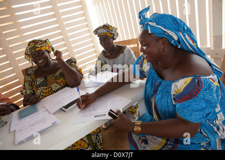 A woman signs for a microfinance loan in Doba, Chad, Africa. Stock Photo