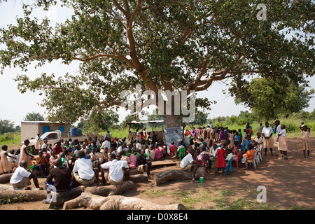 Students receive porridge at break time a school in Amuria, Uganda, East Africa. Stock Photo