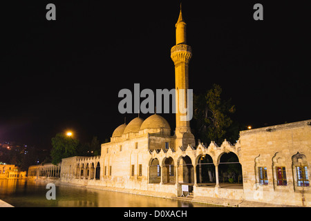 Rızvaniye Vakfı mosque and pool floodlit at night in Sanliurfa, Turkey Stock Photo