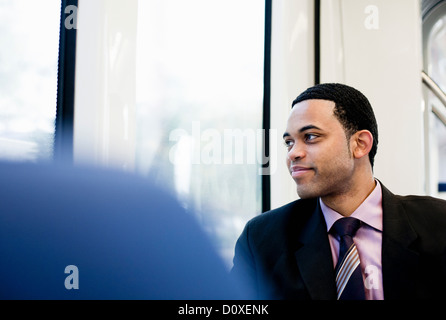 Businessman on a train Stock Photo