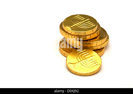 Chocolate Gold Coins wrapped in Gold foil with Jewish Menorah embossed Hanukkah Gelt Stock Photo
