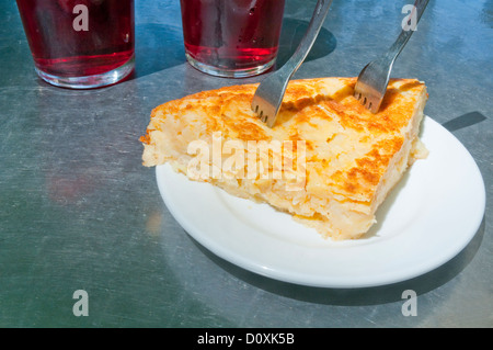 Spanish appetizer: Spanish omelet serving and tinto de verano in a terrace. Madrid, Spain. Stock Photo