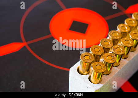 Rifle Ammunition caliber 30-30 on target disk Stock Photo